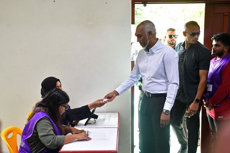 Maldives' President Mohamed Muizzu prepares to cast his ballot during the country's parliamentary election, in Male on 21 April, 2024.