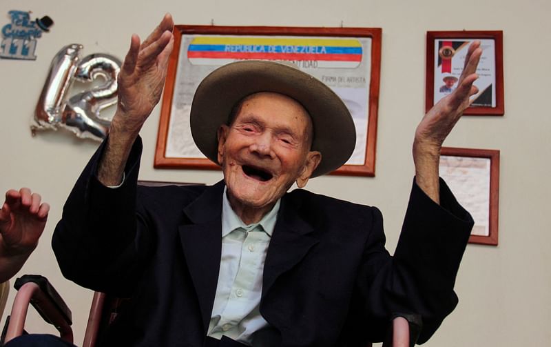 112-year-old Venezuelan farmer Juan Vicente Pérez gestures at his home in San Jose de Bolivar, Tachira state, Venezuela, on 24 January 2022.