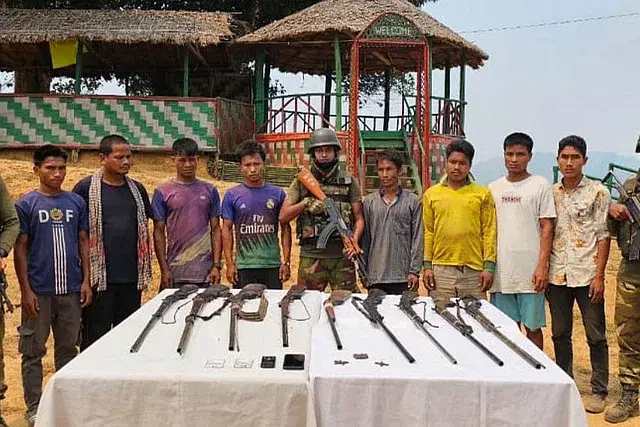 Arrested KNF members with arms and ammunition.