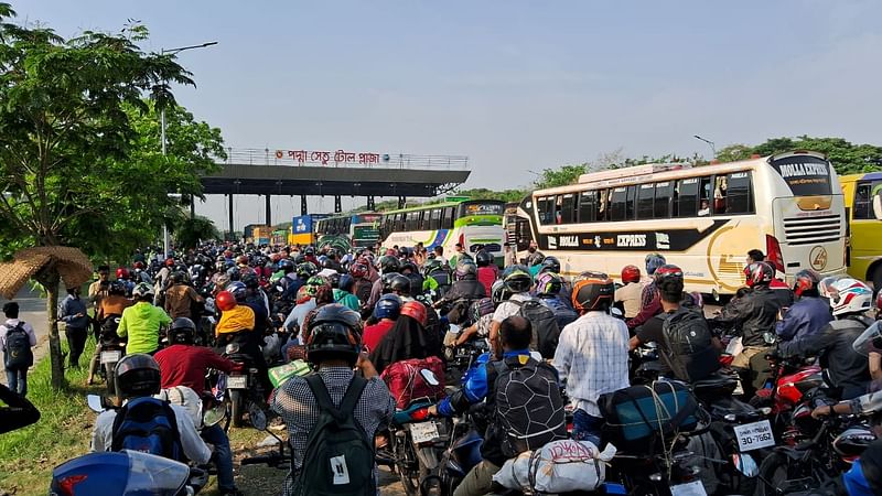 Vehicles wait at the toll plaza to cross the Padma Bridge