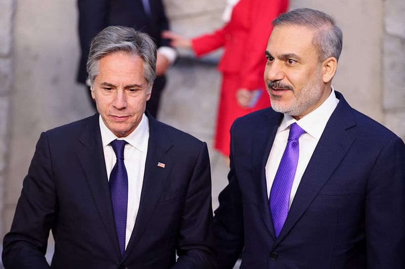 US Secretary of State Antony Blinken (L) stands with Turkey's Foreign Minister Hakan Fidan (R) during the North Atlantic Council (NAC) Ministers of Foreign Affairs meeting at the NATO headquarters in Brussels on 3 April, 2024