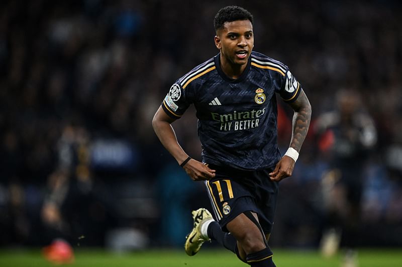 Real Madrid’s Brazilian forward #11 Rodrygo celebrates after scoring his team first goal during the UEFA Champions League quarter-final second-leg football match between Manchester City and Real Madrid, at the Etihad Stadium, in Manchester, north-west England, on 17 April, 2024