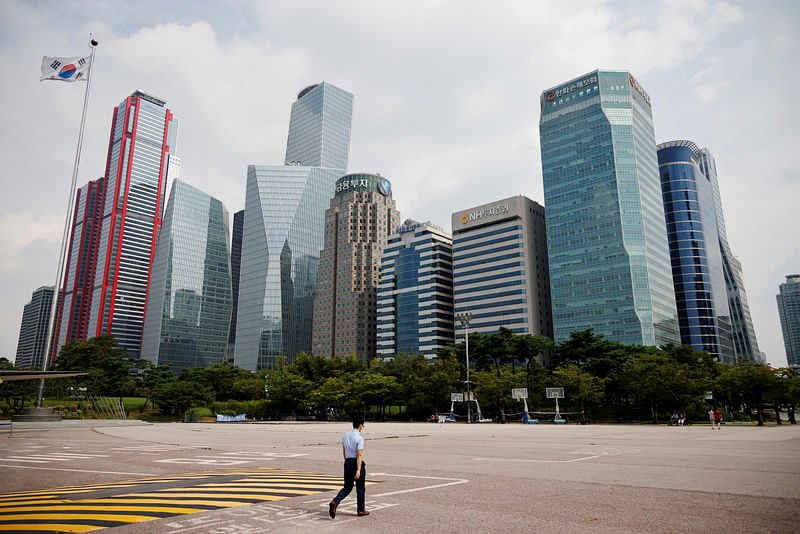 An employee walks at an empty park near a financial district in Seoul, South Korea, 10 September 2020.