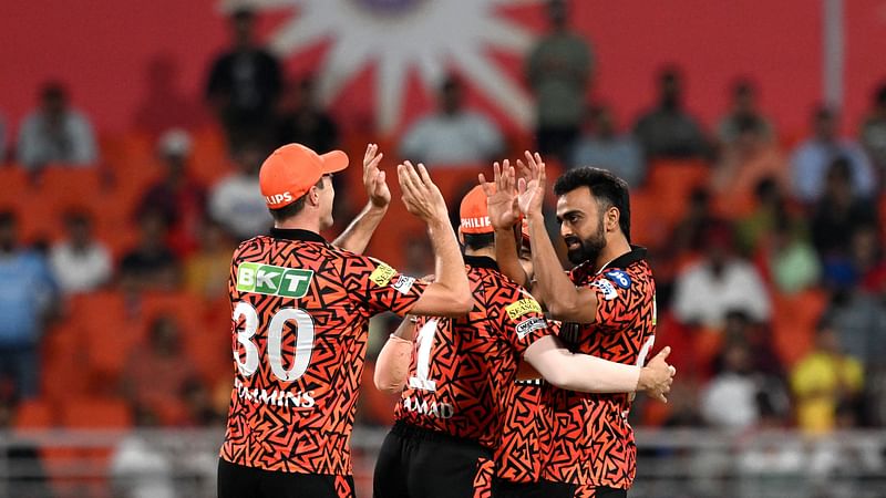 Sunrisers Hyderabad's Jaydev Unadkat (R) celebrates with teammates after taking the wicket of Punjab Kings' Sikandar Raza during the Indian Premier League (IPL) Twenty20 cricket match between Punjab Kings and Sunrisers Hyderabad at the Maharaja Yadavindra Singh International Cricket Stadium in Mohali on 9 April, 2024