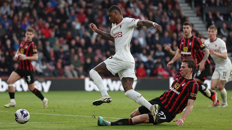 Bournemouth's Ukrainian defender #27 Illia Zabarnyi (R) vies with Manchester United's English striker #10 Marcus Rashford (C) during the English Premier League football match between Bournemouth and Manchester United at the Vitality Stadium in Bournemouth, southern England on 13 April, 2024