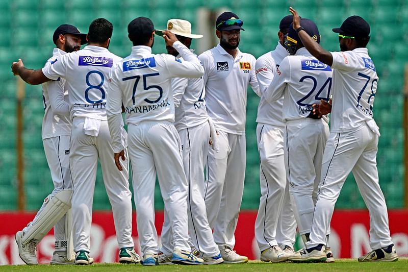 Sri Lanka’s players celebrate their win at the end of the final day of the second and last Test cricket match between Bangladesh and Sri Lanka at the Zahur Ahmed Chowdhury Stadium in Chittagong on 3 April, 2024