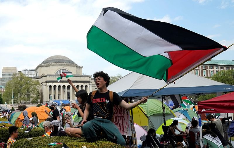 Protestors wave Palestinian flags on the West Lawn of Columbia University on April 29, 2024 in New York