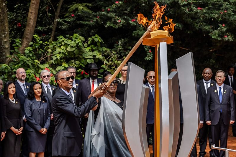 resident of Rwanda Paul Kagame (C L) and his wife Jeannette Kagame (C R) light a remembrance flame surrounded by heads of state and other dignitaries as part of the commemorations of the 30th Anniversary of the 1994 Rwandan genocide at the Kigali Genocide Memorial in Kigali on April 7, 2024