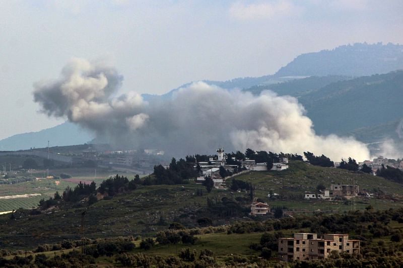 Smoke billows over the area of an Israeli air strike on the southern Lebanese village of Kfar Kila near the border with Israel on April 14, 2024, amid ongoing cross-border tensions as fighting continues between Israel and Hamas militants in the Gaza Strip