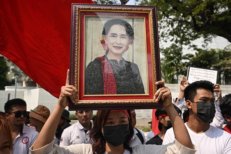 Protesters hold an image of detained civilian leader Aung San Suu Kyi during a demonstration outside the UN office in Bangkok on February, 2024, to mark the third anniversary of the coup in Myanmar.