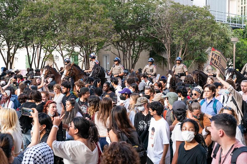 Texas State Troopers on horseback work to disperse pro-Palestinian students protesting the Israel-Hamas war on the campus of the University of Texas in Austin, Texas, on 24 April, 2024