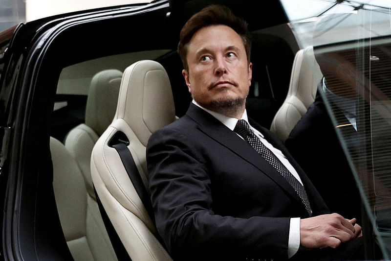 Tesla Chief Executive Officer Elon Musk gets in a Tesla car as he leaves a hotel in Beijing, China on 31 May, 2023