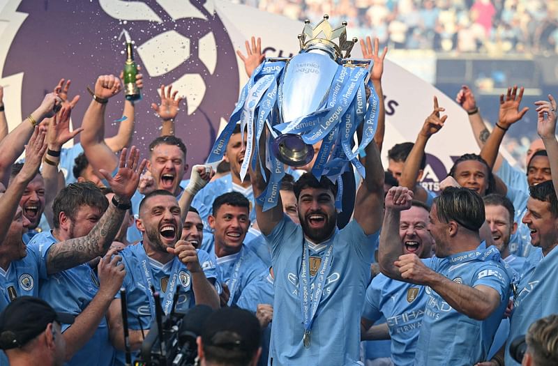 Manchester City players lift premier league trophy