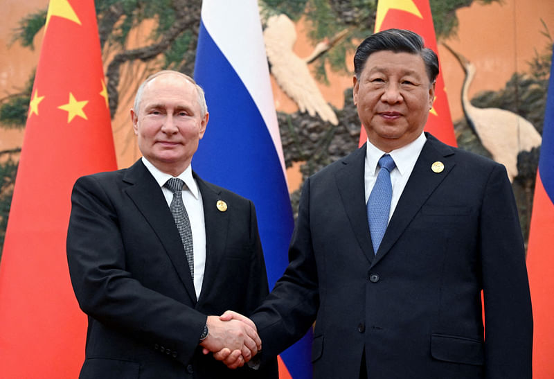 Russian President Vladimir Putin shakes hands with Chinese President Xi Jinping during a meeting at the Belt and Road Forum in Beijing, China, on 18 October, 2023