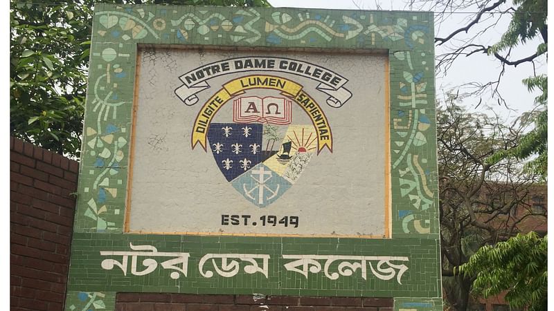 Photo shows the name plaque of Notre Dame College in Dhaka.