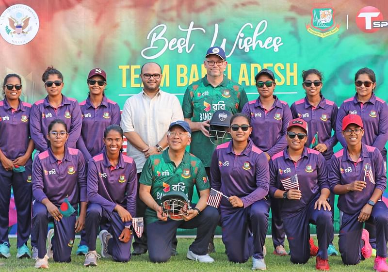 US assistant secretary of state for South and Central Asian affairs, Donald Lu and US ambassador to Dhaka Peter Haas pose for a photo with the Bangladesh National Women's cricket team on Wednesday