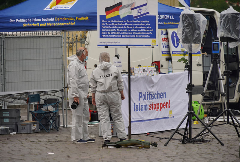 Police investigators work at the scene where a man attacked people at a far right-wing information stand of the Buergerbewegung Pax Europa (BPE) in the central market of the city of Mannheim, Germany, on 31 May, 2024