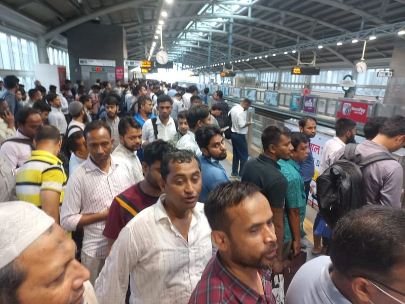 People waiting for metro rail at the Shewrapara station