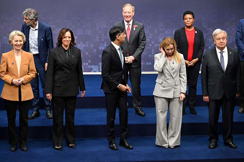 European Commission President Ursula von der Leyen, US Vice President Kamala Harris, British Prime Minister Rishi Sunak, Italy’s Prime Minister Giorgia Meloni, UN Secretary-General Antonio Guterres, Yoshua Bengio, founder and scientific director of Mila at the Quebec AI Institute, Vice Chair and President at Microsoft Brad Smith, White House Office of Science and Technology Policy acting director Alondra Nelson pose for a photo on the second day of the UK Artificial Intelligence (AI) Safety Summit at Bletchley Park, Britain, on 2 November, 2023