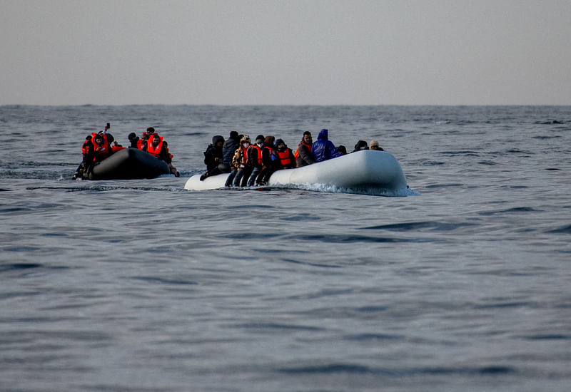 Two inflatable dinghies carrying migrants make their way towards England in the English Channel, Britain, 4 May 2024.