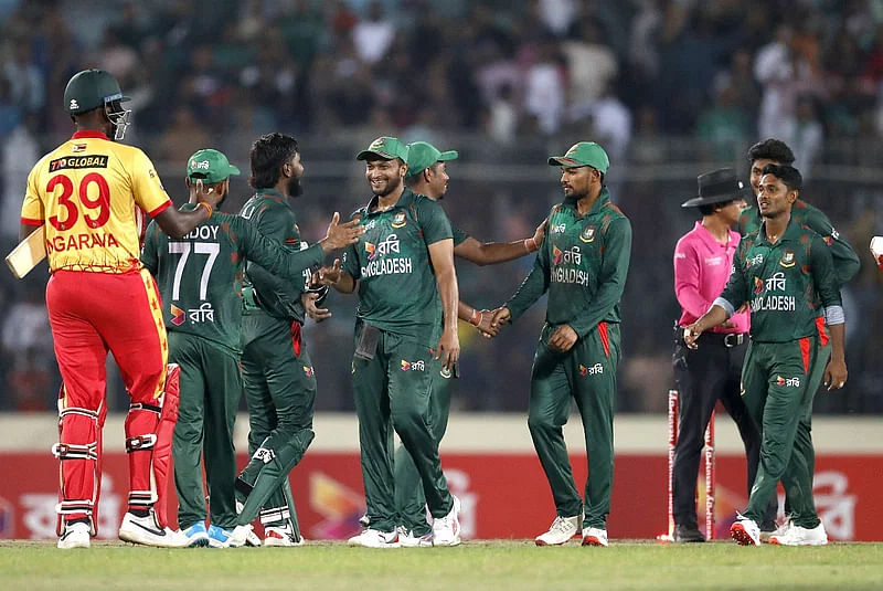 Players of Bangladesh and Zimbabwe shake hands after the match