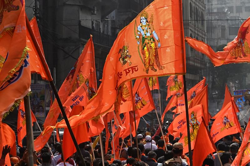 Devotees carry flags of Hindu deity Ram on the occasion of Ayodhya Ram temple's consecration ceremony in Kolkata on 22 January, 2024