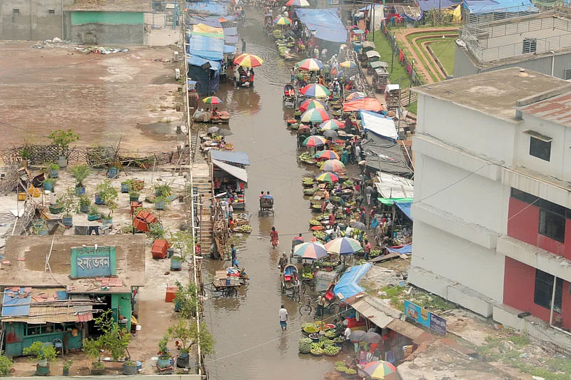 A waterlogged street in Karwan Bazar area of the capital. Photo taken around 12:00pm on 11 May 2024.