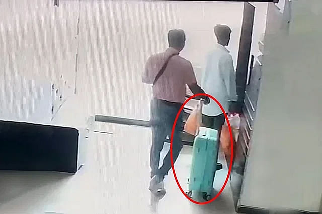 CCTV footage of two persons carrying luggage at the apartment MP Anwarul Azim was killed