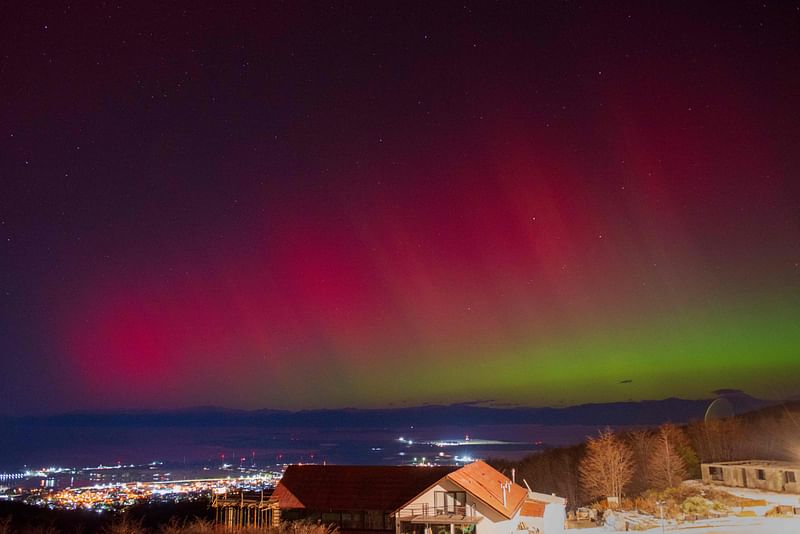 The Aurora Australis, also known as the Southern Lights, glow on the horizon as seen from Ushuaia, Tierra del Fuego, Argentina on 10 May, 2024. But solar activity is only just approaching the peak of a roughly 11-year cycle, so the odds of another major storm are highest "between now and the end of next year," Mike Bettwy of the US Space Weather Prediction Center said.