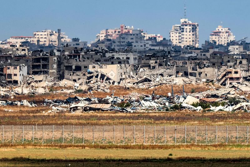 This picture taken from Israel’s southern border with the Gaza Strip shows destroyed buildings in the Palestinian territory on 14 May, 2024, amid the ongoing conflict between Israel and the militant group Hamas