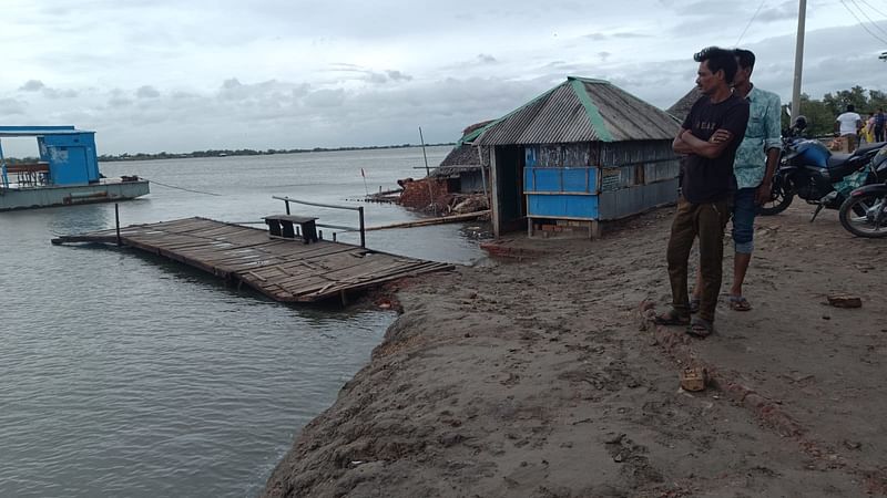 A man looks at the Kopotakkho River in Modinabad of Koyra, adjacent to the Sundarbans, in Khulna on 26 May 2024.