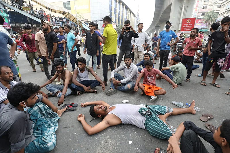 Auto-rickshaw drivers demonstrate blocking the road in Mirpur-10 roundabout area on 19 May, 2024. The photo was taken around 10 am