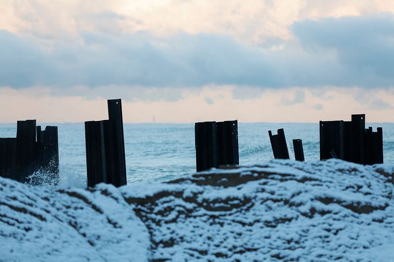 Pylons are used as a wave break at Indiana Dunes National Park on November 1, 2023. At Indiana Dunes National Park, beaches are submerged, and the namesake dunes are collapsing