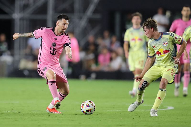 Inter Miami's Argentine forward Lionel Messi fights for the ball with US midfielder Daniel Edelman during the Major League Soccer (MLS) football match between Inter Miami CF and the New York Red Bulls at Chase Stadium in Fort Lauderdale, Florida, on 4 May, 2024.