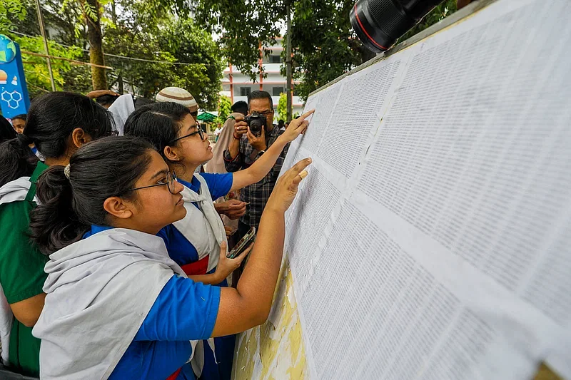 The results of SSC and equivalent exams have been published today. Anxious students and guardians search for their result on a board. Photo taken from Dr Khastagir Government Girls’ High School in Chattogram on 12 May