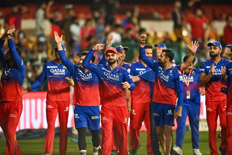 RCB players celebrate after winning the Indian Premier League (IPL) Twenty20 cricket match against Chennai Super Kings at the M Chinnaswamy Stadium in Bengaluru on 18 May, 2024.