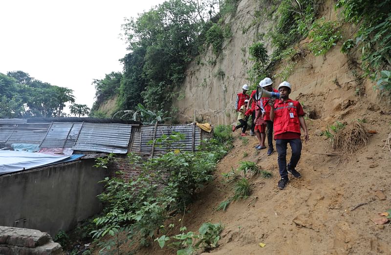 As cyclone Remal approaches, Red Crescent members make PA announcements urging people to move to safe place in Lalkhan Bazar, Chattogram on 26 May 2024.