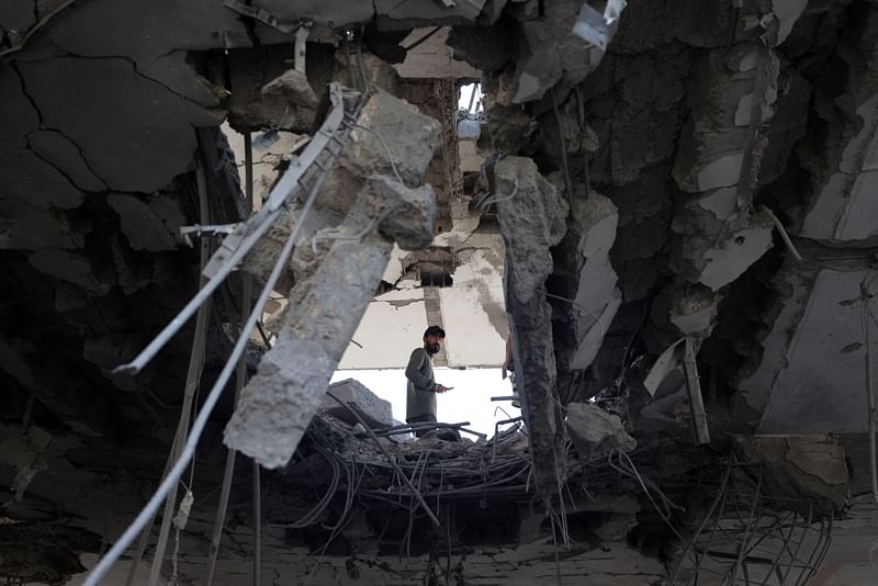 A Palestinian man stands amid the rubble of a building destroyed by Israeli bombing in Rafah in the southern Gaza Strip on 3 May, 2024, as the conflict between Israel and the Hamas movement continues.