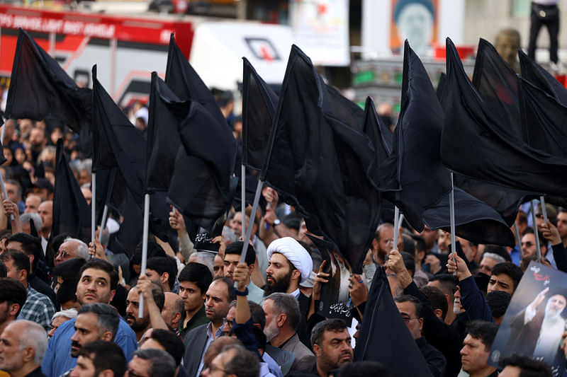 Iranians gather at Valiasr Square in central Tehran to mourn the death of President Ebrahim Raisi and Foreign Minister Hossein Amir-Abdollahian in a helicopter crash the previous day, on May 20, 2024