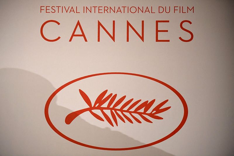 The logo of the International Cannes Film Festival is pictured during a press conference to announce the movies in official competition for the upcoming 70th International Cannes film festival, in Paris, on 13 April, 2017. A collective of cinema workers haved called for strike on 6 May, 2024, one week before the opening of the 77th edition of the Cannes Film Festival.