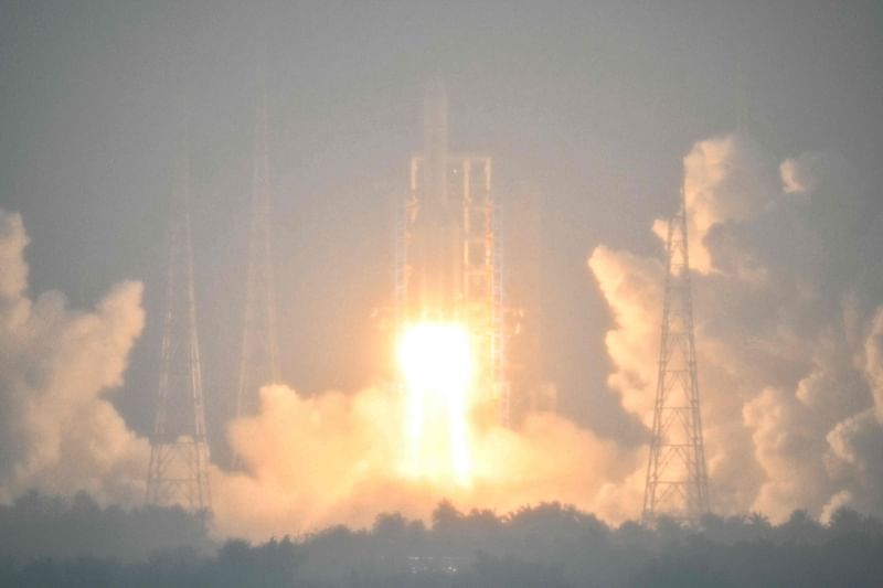 A Long March 5 rocket, carrying the Chang'e-6 mission lunar probe, lifts off as it rains at the Wenchang Space Launch Centre in southern China's Hainan Province on 3 May, 2024. China is set on 3 May to launch a probe to collect samples from the far side of the Moon, a world first as Beijing pushes ahead with an ambitious programme that aims to send a crewed lunar mission by 2030.