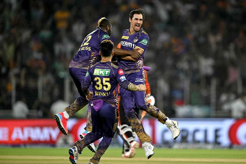 Kolkata Knight Riders' Mitchell Starc (R) celebrates with teammates after taking the wicket of Sunrisers Hyderabad's Travis Head (not pictured) during the Indian Premier League (IPL) Twenty20 first qualifier cricket match between Sunrisers Hyderabad and Kolkata Knight Riders at the Narendra Modi Stadium in Ahmedabad on May 21, 2024