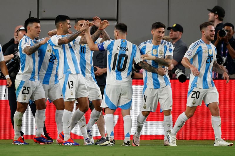 Argentina's players celebrate after scoring a goal during the Conmebol 2024 Copa America tournament group A football match between Chile and Argentina at MetLife Stadium in East Rutherford, New Jersey on 26 June, 2024