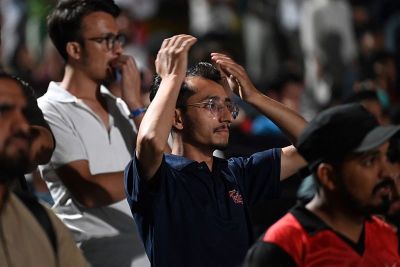 A Pakistan cricket supporter reacts after India defeated Pakistan during a live broadcast of the 2024 ICC men's Twenty20 World Cup group A cricket match between Pakistan and India played in New York, at the Rawalpindi Cricket Stadium in Rawalpindi on June 10, 2024