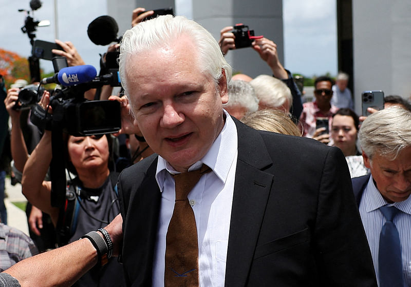 WikiLeaks founder Julian Assange walks outside United States District Court following a hearing, in Saipan, Northern Mariana Islands, US, 26 June 2024.