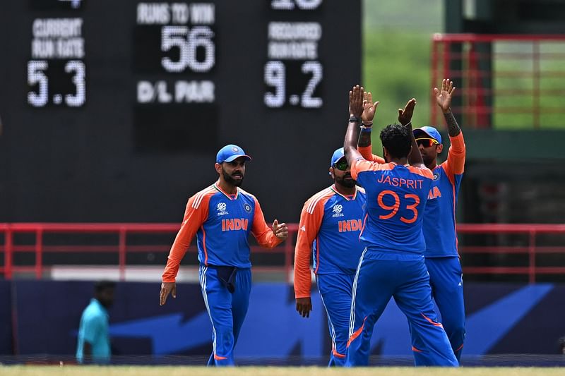 India's Jasprit Bumrah celebrates with teammates after dismissing Australia's Travis Head during the ICC men's Twenty20 World Cup 2024 Super Eight cricket match between Australia and India at Daren Sammy National Cricket Stadium in Gros Islet, Saint Lucia on 24 June, 2024