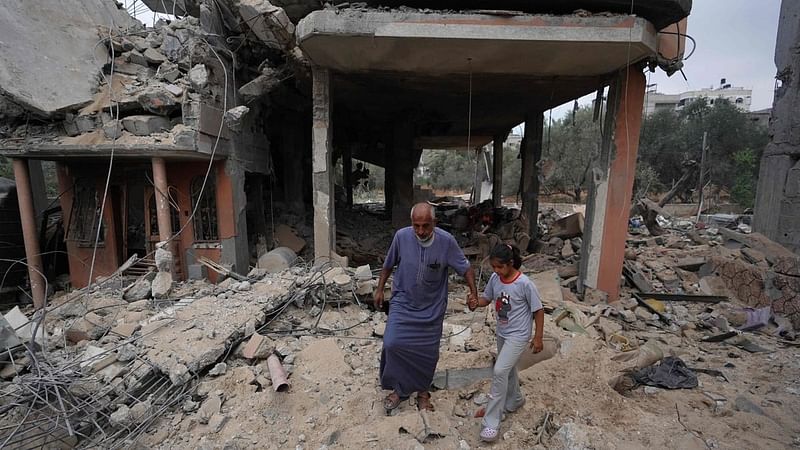 Palestinians inspect the damage after an Israeli strike in Nuseirat, in the central Gaza Strip, on 3 June, 2024, amid the ongoing conflict between Israel and the Palestinian Hamas militant group