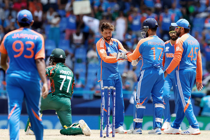 India's Kuldeep Yadav and teammates celebrate the dismissal of Bangladesh's Towhid Hridoy during the Super 8 Group 1 match of the ICC Mens T20 World Cup 2024, at Sir Vivian Richards Stadium in Antigua on Saturday