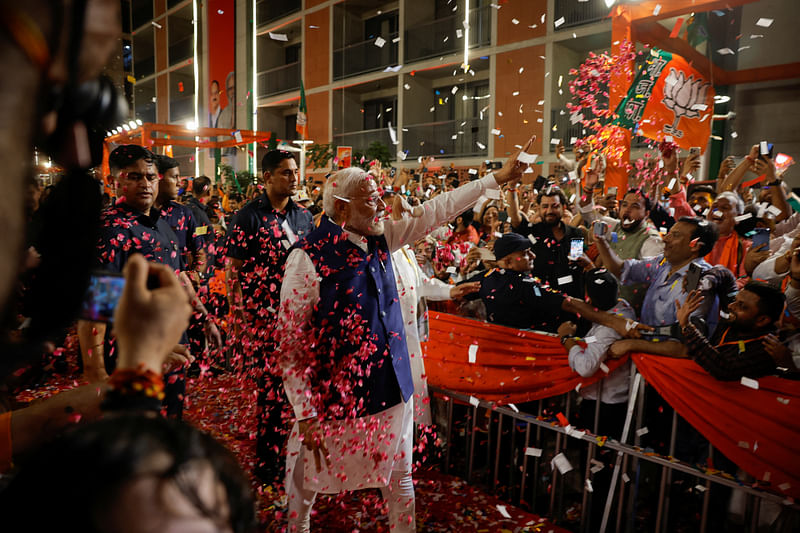 Indian Prime Minister Narendra Modi gestures as he arrives at Bharatiya Janata Party (BJP) headquarters in New Delhi, India, 4 June 2024.