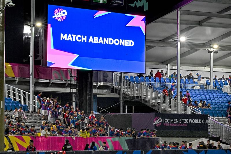 Nepal's supporters cheer to their team after the match gets abandoned due to weather conditions during the ICC men's Twenty20 World Cup 2024 group D cricket match between Sri Lanka and Nepal at Central Broward Park & Broward County Stadium in Lauderhill, Florida on June 11, 2024